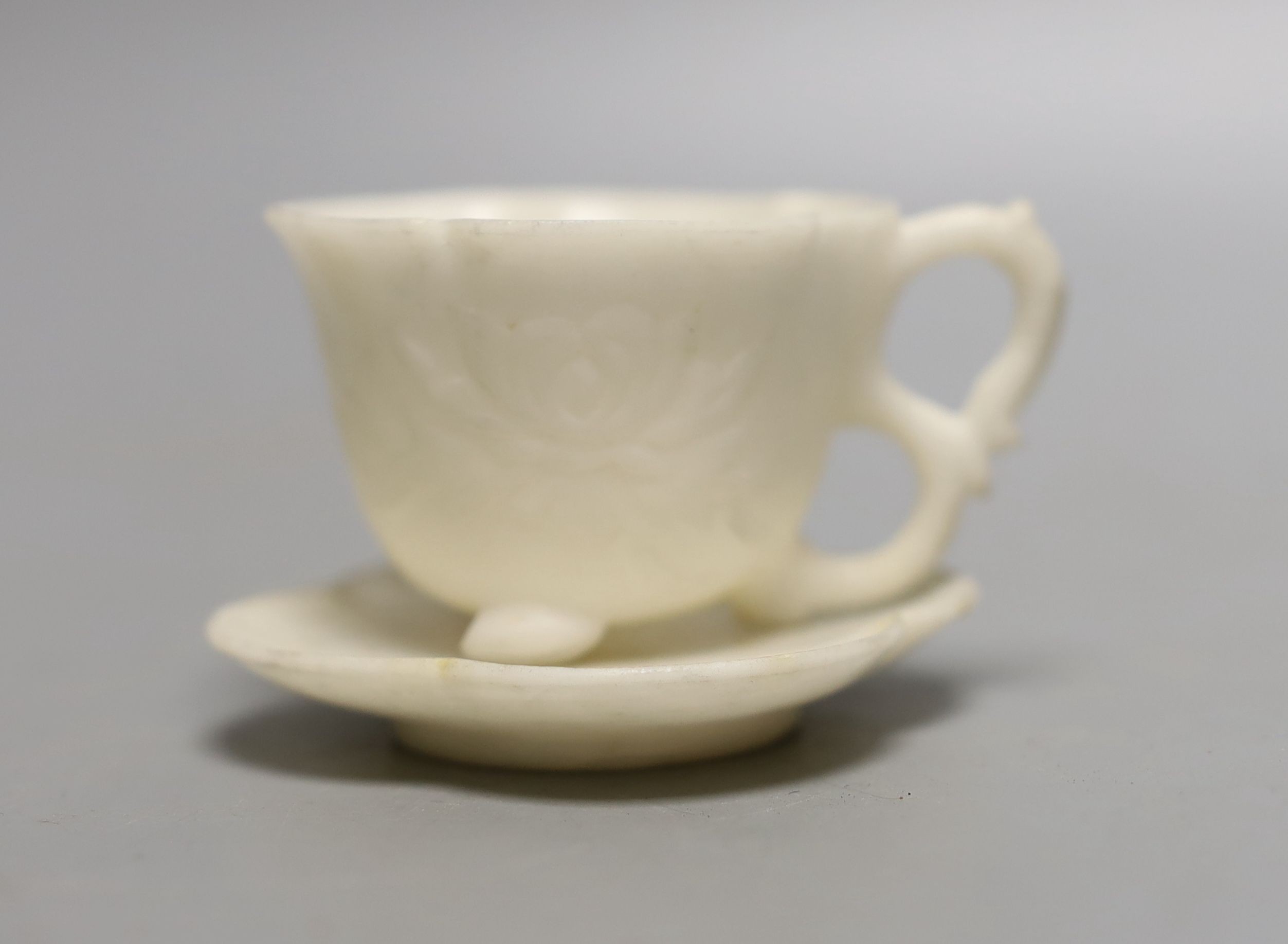 A White hardstone tea cup and saucer - 5cm tall